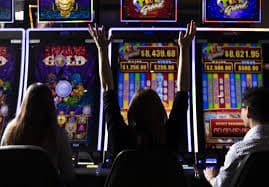 Live dealer at a blackjack table in a multi-camera studio